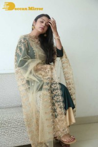 Varsha Bollamma photoshoot in a dark green salwar kameez