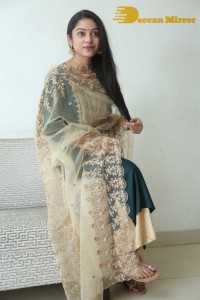 Varsha Bollamma photoshoot in a dark green salwar kameez