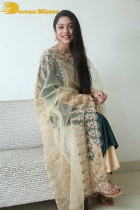 Varsha Bollamma photoshoot in a dark green salwar kameez