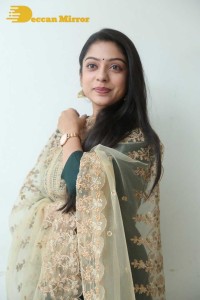 Varsha Bollamma photoshoot in a dark green salwar kameez