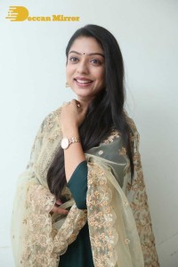 Varsha Bollamma photoshoot in a dark green salwar kameez