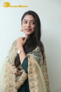 Varsha Bollamma photoshoot in a dark green salwar kameez