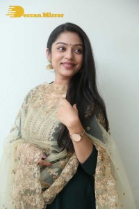 Varsha Bollamma photoshoot in a dark green salwar kameez