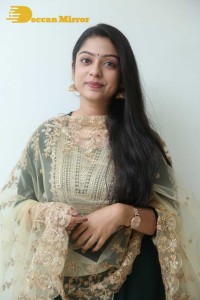 Varsha Bollamma photoshoot in a dark green salwar kameez