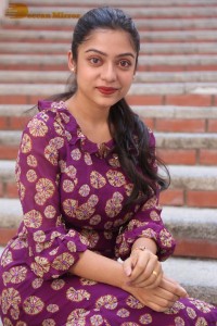 Telugu Actress Varsha Bollamma Photoshoot in a violet dress