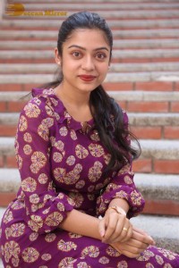 Telugu Actress Varsha Bollamma Photoshoot in a violet dress