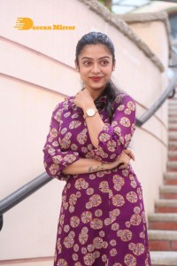 Telugu Actress Varsha Bollamma Photoshoot in a violet dress