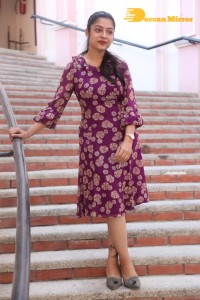 Telugu Actress Varsha Bollamma Photoshoot in a violet dress