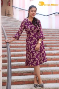 Telugu Actress Varsha Bollamma Photoshoot in a violet dress