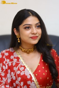 Indian Actress Varsha Bollamma in a red dress