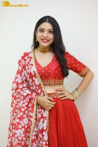 Indian Actress Varsha Bollamma in a red dress