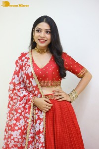 Indian Actress Varsha Bollamma in a red dress