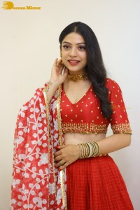 Indian Actress Varsha Bollamma in a red dress