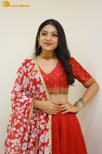 Indian Actress Varsha Bollamma in a red dress
