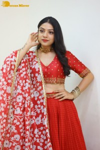 Indian Actress Varsha Bollamma in a red dress