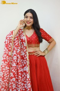 Indian Actress Varsha Bollamma in a red dress
