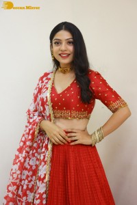 Indian Actress Varsha Bollamma in a red dress