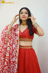 Indian Actress Varsha Bollamma in a red dress