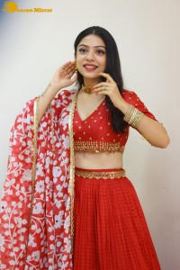Indian Actress Varsha Bollamma in a red dress
