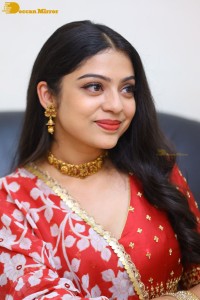 Indian Actress Varsha Bollamma in a red dress