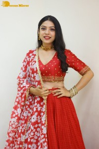 Indian Actress Varsha Bollamma in a red dress