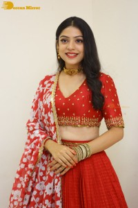 Indian Actress Varsha Bollamma in a red dress