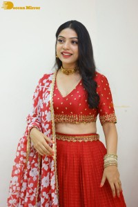 Indian Actress Varsha Bollamma in a red dress