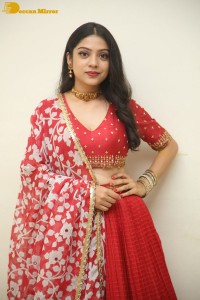Indian Actress Varsha Bollamma in a red dress