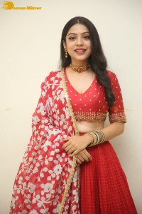 Indian Actress Varsha Bollamma in a red dress