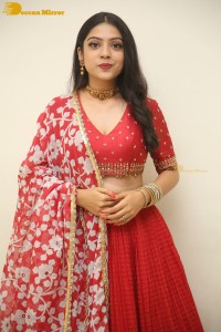 Indian Actress Varsha Bollamma in a red dress