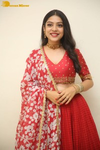 Indian Actress Varsha Bollamma in a red dress
