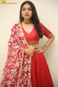 Indian Actress Varsha Bollamma in a red dress