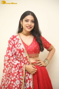 Indian Actress Varsha Bollamma in a red dress
