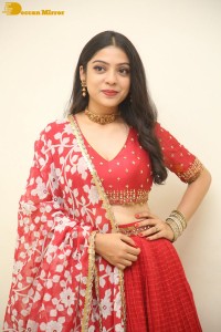 Indian Actress Varsha Bollamma in a red dress