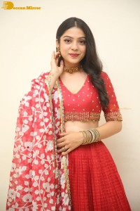 Indian Actress Varsha Bollamma in a red dress