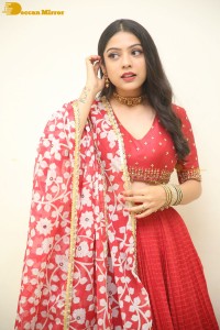Indian Actress Varsha Bollamma in a red dress