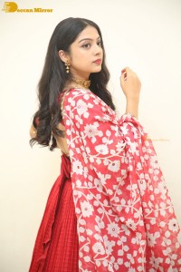 Indian Actress Varsha Bollamma in a red dress