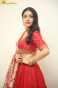 Indian Actress Varsha Bollamma in a red dress