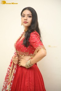 Indian Actress Varsha Bollamma in a red dress