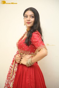 Indian Actress Varsha Bollamma in a red dress