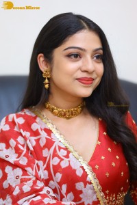 Indian Actress Varsha Bollamma in a red dress