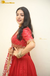 Indian Actress Varsha Bollamma in a red dress