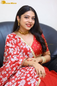 Indian Actress Varsha Bollamma in a red dress