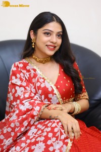 Indian Actress Varsha Bollamma in a red dress