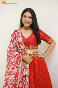Indian Actress Varsha Bollamma in a red dress