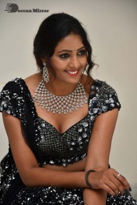 Vasista Chowdary in a Black Dress posing for a Photoshoot