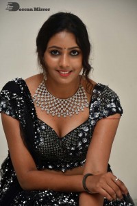 Vasista Chowdary in a Black Dress posing for a Photoshoot