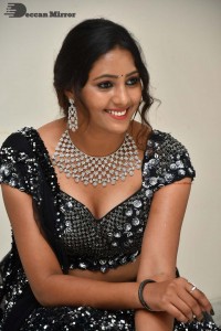 Vasista Chowdary in a Black Dress posing for a Photoshoot