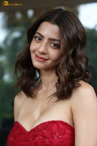 Indian actress vedhika glamorous look in a shoulderless red dress