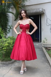 Indian actress vedhika glamorous look in a shoulderless red dress